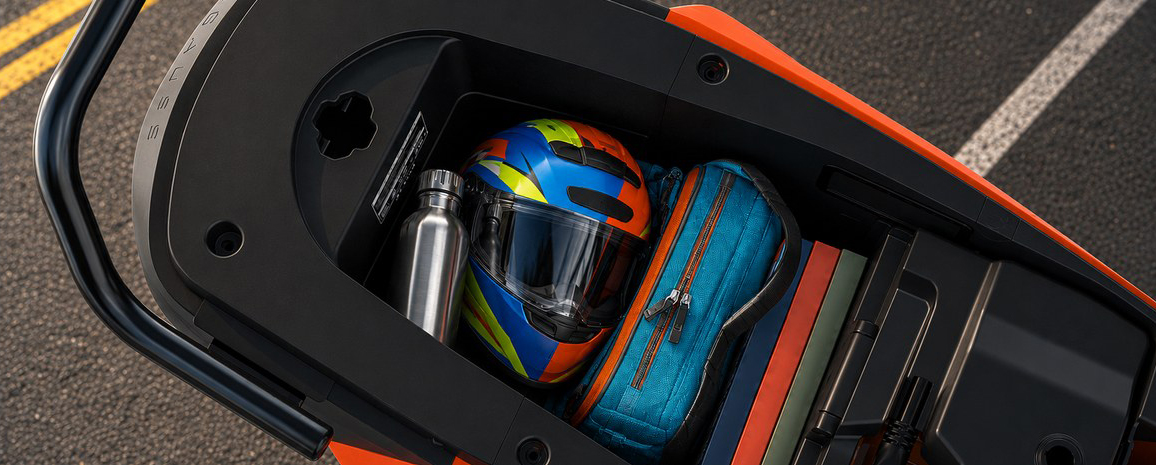 Open under-seat boot holding a helmet, bottle and bag